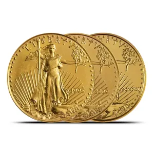 Three 1/4 oz American Gold Eagle coins stacked, partially overlapping on a white background.